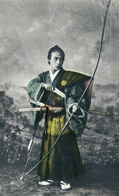Traditional Yumi archer — yugake release grip Vintage portrait of a samurai archer holding a Yumi, illustrating the traditional yugake thumb-release grip
