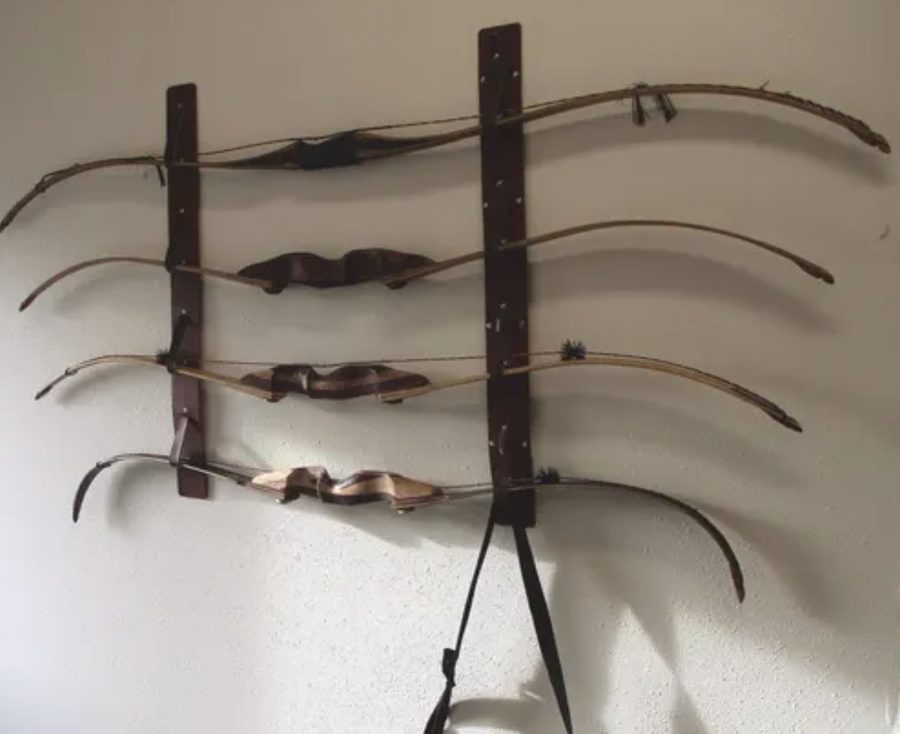 Recurve bows mounted on a wall storage rack