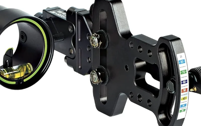 HHA Optimizer Lite sight mounted on a compound bow riser, showing the pre-printed setup tape with yardage marks from 20 to 80