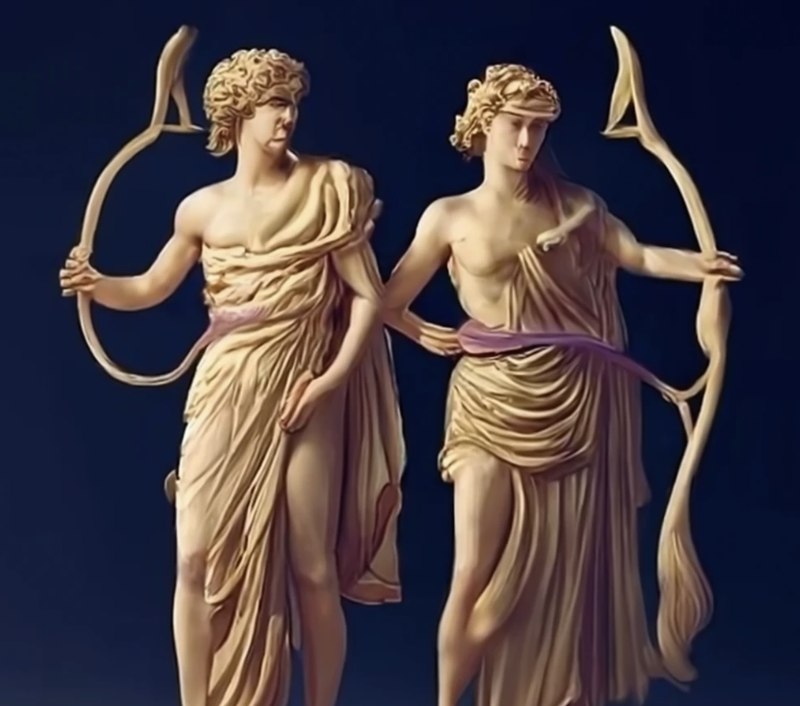 Sculptural rendering of Apollo and Artemis standing together, each holding a drawn bow, against a dark blue background