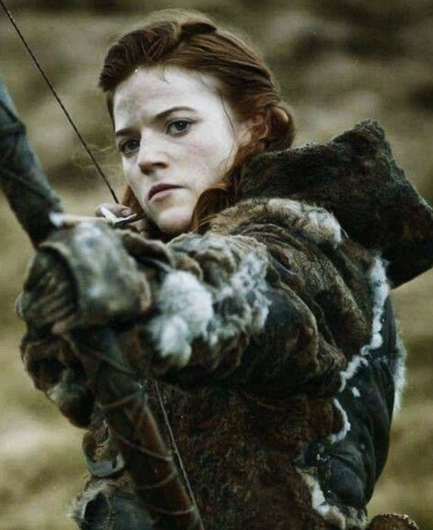 Rose Leslie as Ygritte drawing a bow in HBO's Game of Thrones
