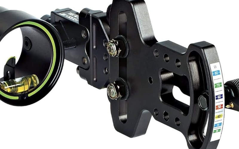 HHA Optimizer Lite sight mounted on a compound bow riser, showing the pre-printed setup tape with yardage marks