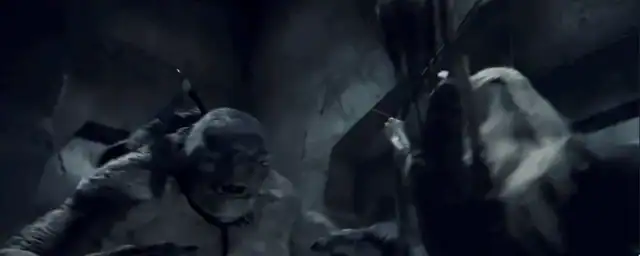 Legolas drawing his bow inside the Mines of Moria during the Cave Troll fight